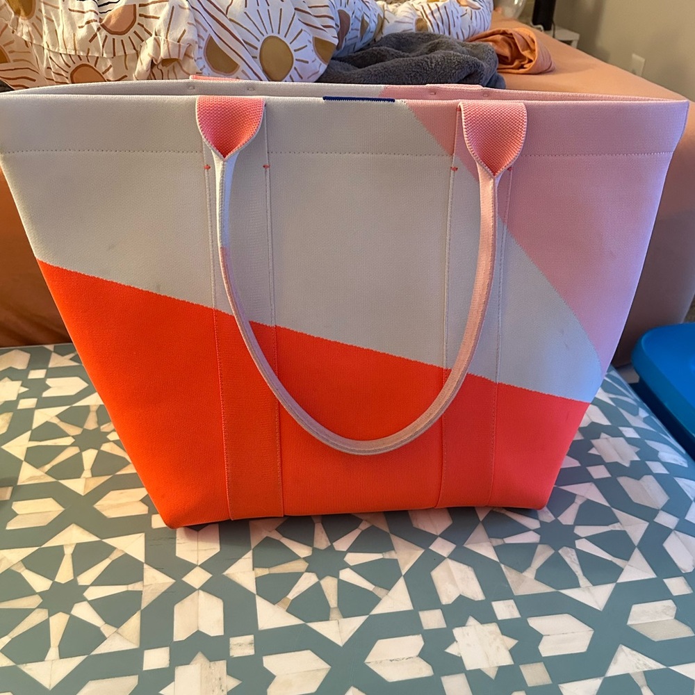 Rothy’s essential tote in neon prism